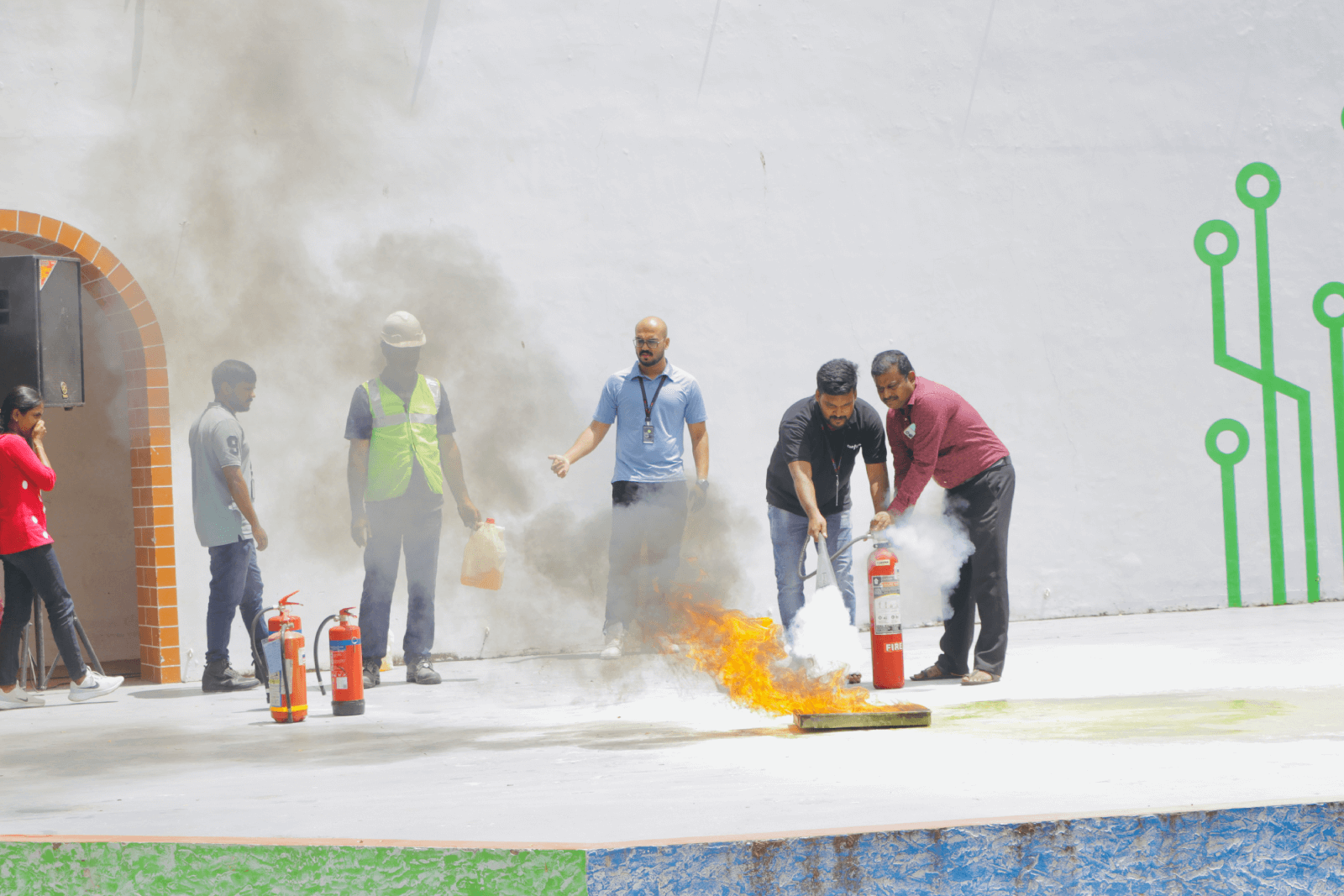 The Technopark Fire & Safety team demonstrating how to put out a fire using the right equipment.