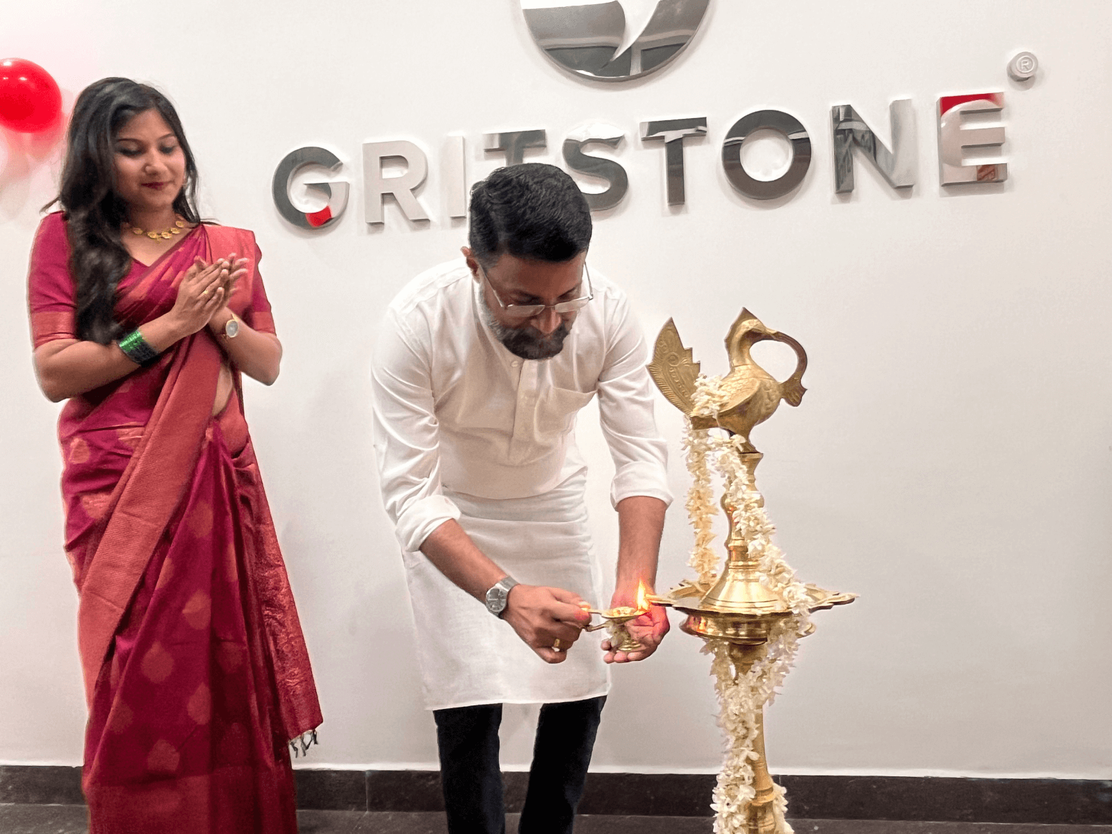 Col Nair lighting the ceremonial lamp at the Gritstone Technologies launch at Technocity.