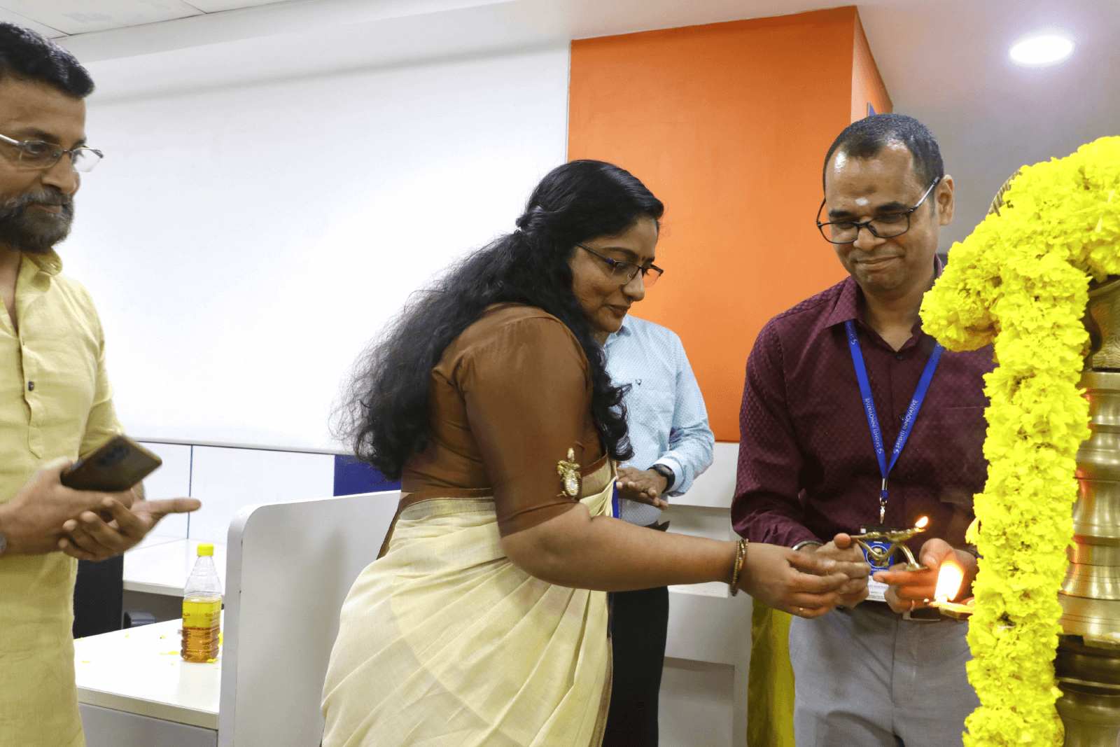 Lighting the ceremonial lamp.