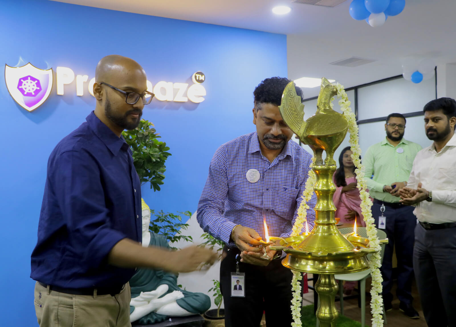 Mr. Vasanth Varada lighting the ceremonial lamp to inaugurate Prophaze office at Technopark.