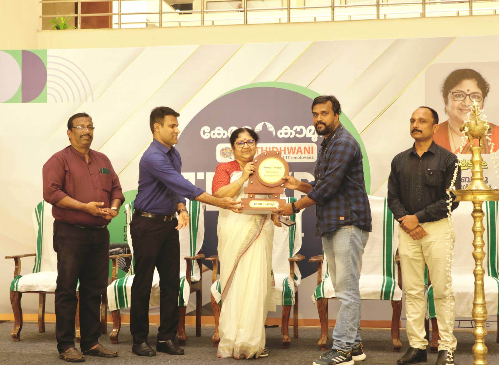 Dr. R Bindu receiving a token of appreciation at the event.