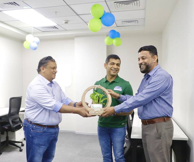 CEO Technopark presenting a token of appreciation to Mr. Raghu Hariharan and Mr. Ritesh Patel, Co-founders of Quantiphi.