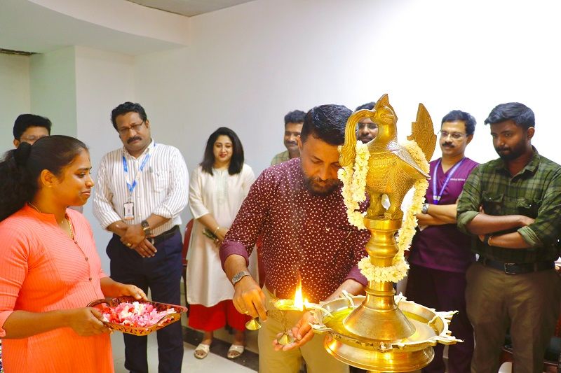 CEO Technopark lighting the inaugural lamp.